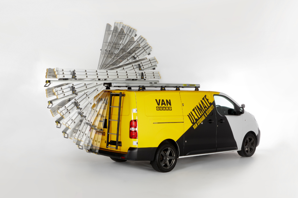 A yellow van with a ladder on top
Description automatically generated